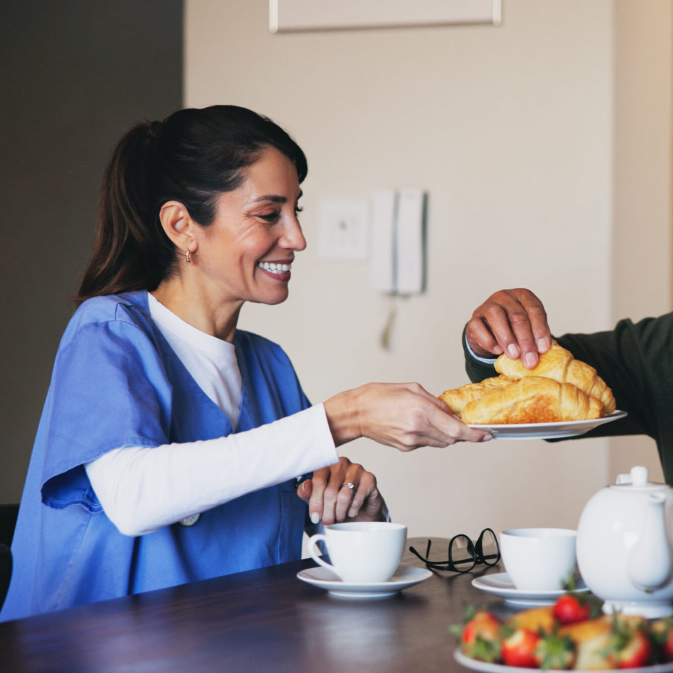 Kitchen, nurse and senior care in nursing home, breakfast and bonding with food and elderly people